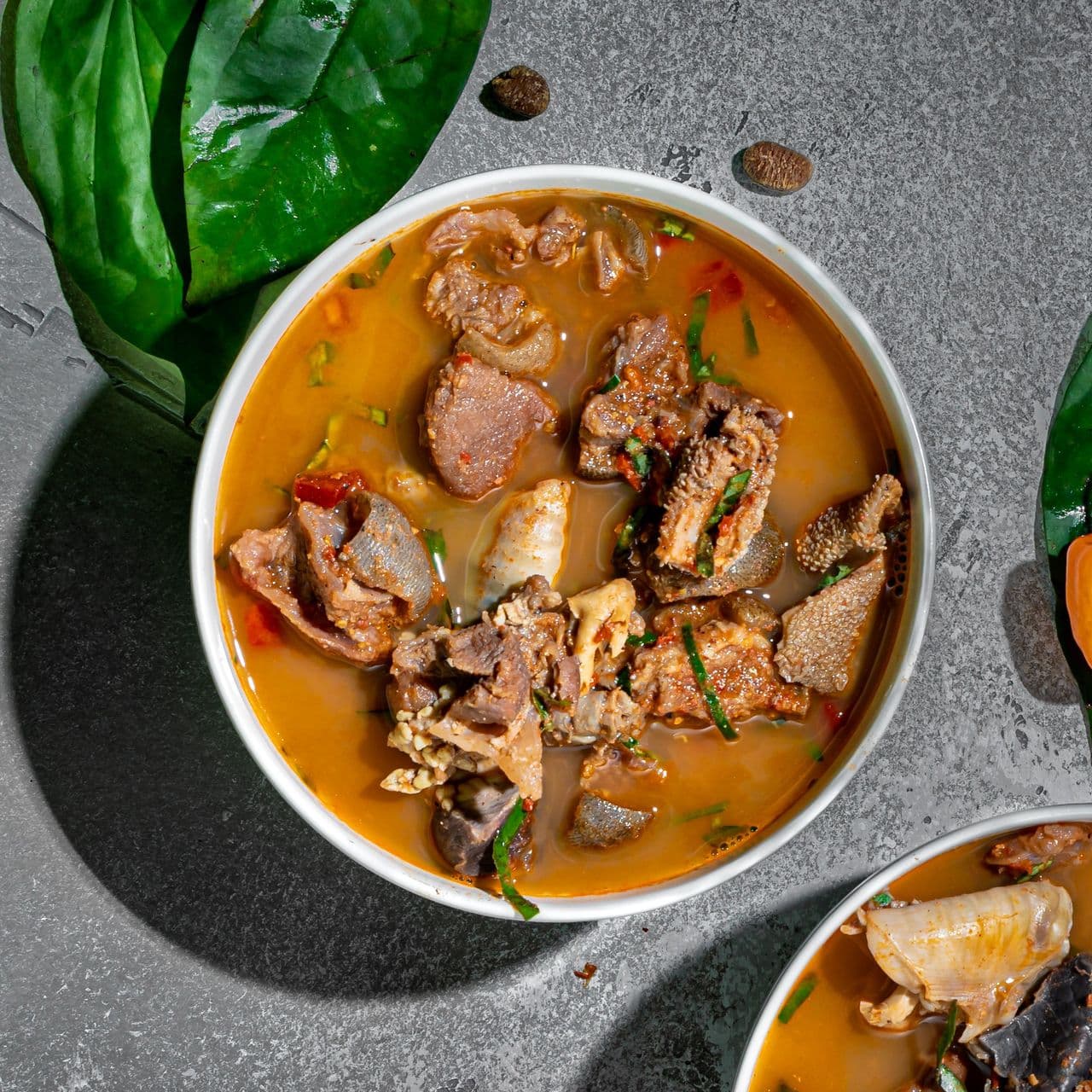 Assorted Meat Pepper Soup image showing Afro-fusion catering presentation
