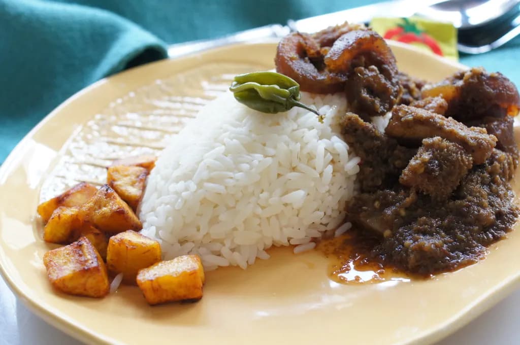Ofada Rice and Ayamase image showing Afro-fusion catering presentation